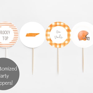 May include: Four circular party toppers on sticks. Designs include orange striped "Rocky Top", a Tennessee outline, orange gingham with "Go Vols", and an orange football helmet. The bottom circle says "Customized Party Toppers!"