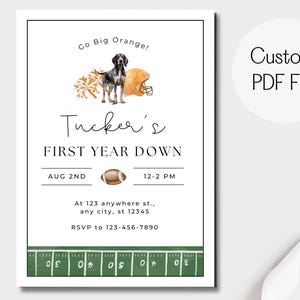 May include: A white invitation with a football theme. The text reads "Go Big Orange!" and "Tucker's FIRST YEAR DOWN." It includes a watercolor illustration of a dog, football helmet, and pom-poms. The date and time are listed, along with an address and RSVP information.
