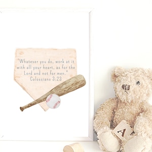 May include: A framed watercolour print with a baseball bat, ball, and home plate illustration. The print includes the text "Whatever you do, work at it with all your heart, as for the Lord and not for men. Colossians 3:23". A teddy bear is also present.