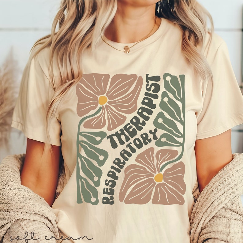 May include: A beige t-shirt with a floral design and the text "Respiratory Therapist" in a retro font.