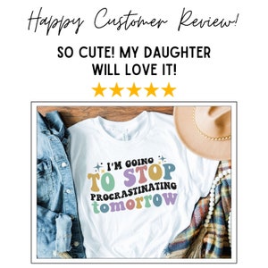 May include: White t-shirt with a colourful graphic that says "I'm going to stop procrastinating tomorrow".