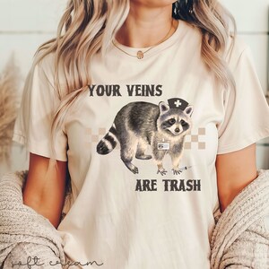Your Veins Are Trash T-Shirt Funny Raccoon Nurse Graphic Tee Goblincore Nurse TShirt Funny Emergency RN Shirts Raccoon Lover Graphic Tees image 2