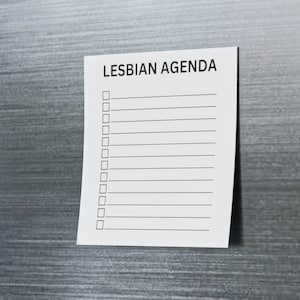 May include: A white sheet of paper with the text "LESBIAN AGENDA" at the top. The paper has a checklist with 12 empty boxes and lines.