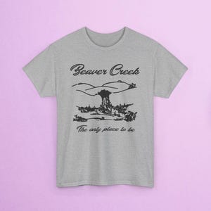 May include: A heather gray t-shirt featuring a black graphic of a landscape with the text "Beaver Creek" above and "The only place to be" below. The shirt has short sleeves and a crew neck.