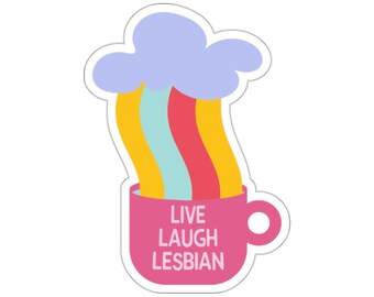 May include: A pink mug with a rainbow and a cloud coming out of it. The mug says "Live Laugh Lesbian".