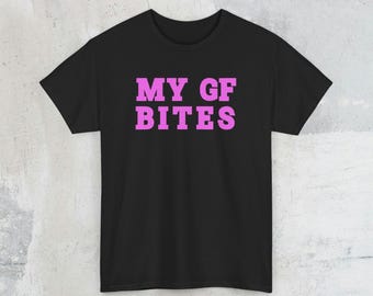 May include: Black t-shirt with the text "MY GF BITES" in pink.