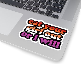 May include: A sticker with the text "eat your girl out or i will" in a rainbow color scheme. The text is in a retro font style.
