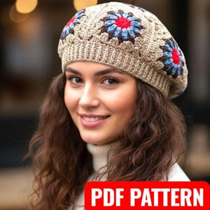May include: A beige crochet beret with floral designs in red, blue, and brown. The beret is worn by a person with long, wavy brown hair. The image includes the text "PDF PATTERN" in a red box.