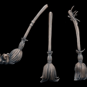 May include: Three wooden broomsticks with different styles of handles and bristles. The broomsticks are all brown and have a rustic look.