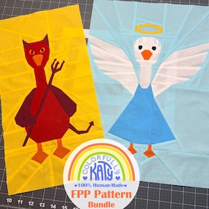 May include: Two fabric quilt blocks featuring a red devil character on a yellow background and a white angel character on a light blue background. A circular logo with a rainbow and the text Colorfully Katy 100% Human-Made FPP Pattern Bundle.