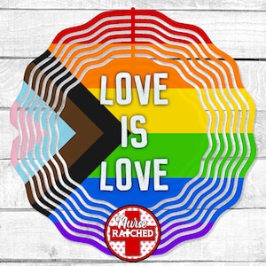 May include: A round, multi-colored design with the words "LOVE IS LOVE" in white. The design incorporates the colors of the rainbow, the transgender flag, and the progress pride flag. A red and white logo with the words "Nurse Ratched" is at the bottom.
