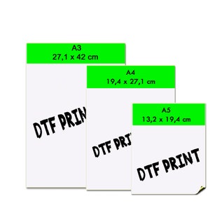 May include: Three white rectangular sheets of paper, labeled A3 (27.1 x 42 cm), A4 (19.4 x 27.1 cm), and A5 (13.2 x 19.4 cm). Each sheet has a green header and the words "DTF PRINT" printed in black.