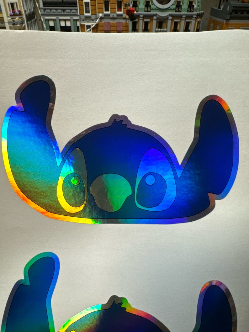 Pick your finish holographic prismatic brushed stitch peeking over window waterproof logo vinyl sticker Easy to customize. Fast shipping image 1