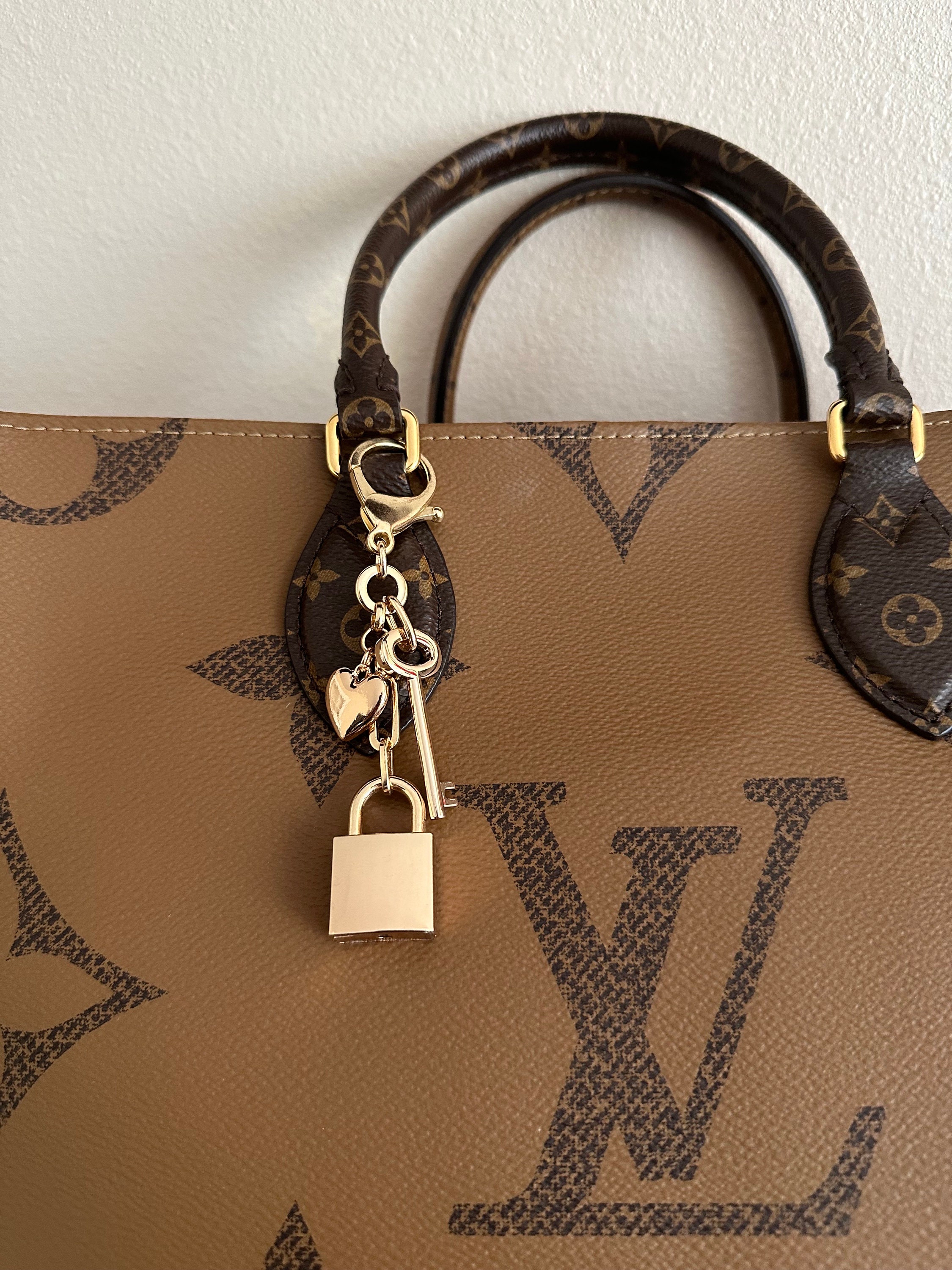 louis vuitton bag with lock and key