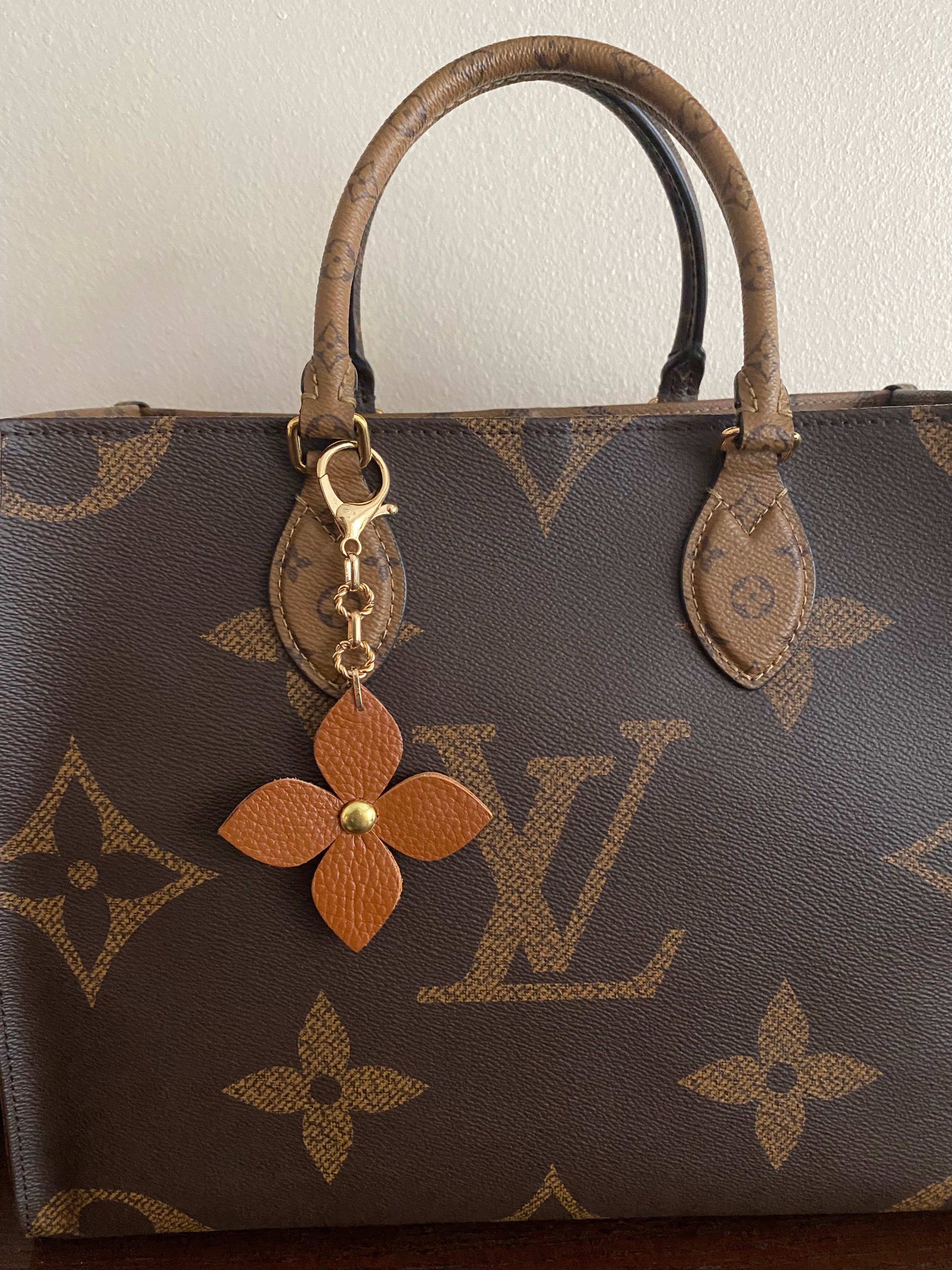 Louis Vuitton Fleur de Monogram Bag Charm and Key Holder Resin and Brass (Authentic Pre-Owned)