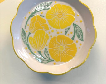 Scalloped side or salad plate with yellow flowers with leaves swirling