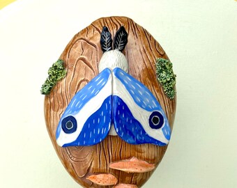 Wall hanging Blue Moth on a log mushrooms fungus wood texture