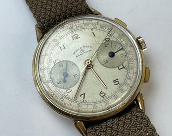 Cronógrafo Election Grand Prix, movimiento Valjoux 22, telémetro chapado en oro, Segunda Guerra Mundial, aviación militar, fabricado en Suiza.