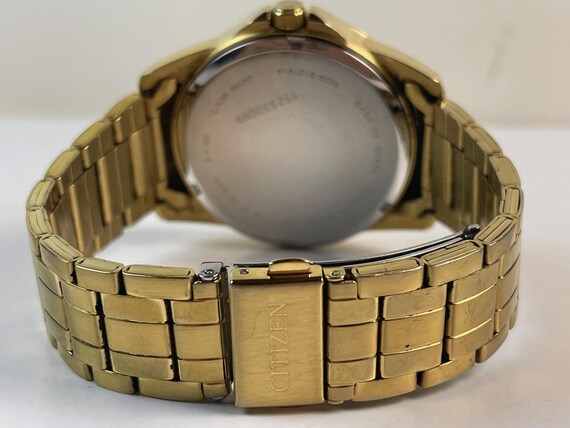 Citizen Multifunction Gold Tone Black Textured Dial Ref. 6329