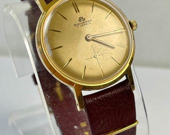 Relógio clássico de vestir Carl F. Bucherer, da Rolex, com caixa em aço inoxidável banhada a ouro e fundo rosqueado. Vintage, fabricado na Suíça em 1956.