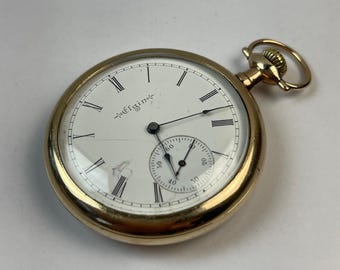 Mouvement Elgin de Burlington Watch Co. logé dans une montre de poche Dila en porcelaine ancienne garantie Burlington 25 $ garantie Savonette fabriquée aux États-Unis
