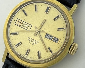 Tissot Seastar T12 automatisk kalender datum guldkåpa stål skruvad bakboett schweizisk tillverkning 1973