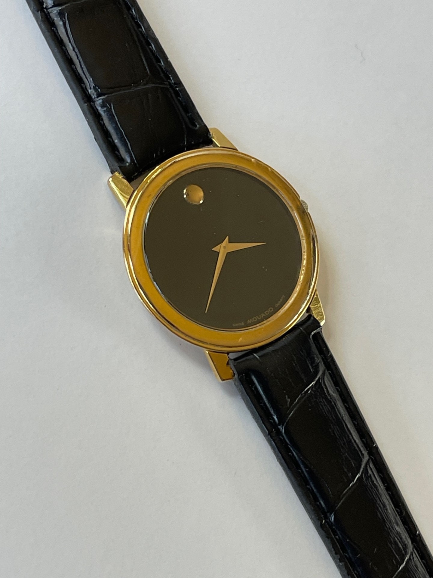 Movado black top and gold