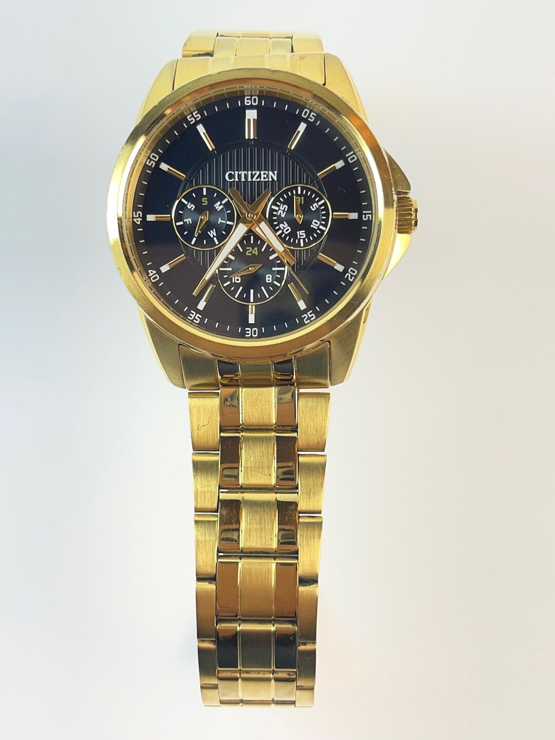 Citizen Multifunction Gold Tone Black Textured Dial Ref. 6329