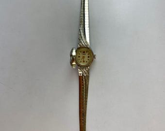 Wakmann Breitling dames verborgen flip cover zilverkleurige getextureerde armband vintage Swiss Made 1961