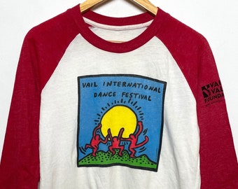 Vintage anni '90 Keith Haring Vail Colorado International Dance Festival Single Stitch Graphic Raglan Art Tee Shirt (adatto per adulti Medium)
