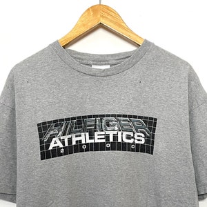Vintage 2000 Tommy Hilfiger Athletics Spell Out Graphic Tee Shirt (fits adult Large)