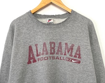 Vintage 1997 Nike Alabama Crimson Tide Football Spell Out Mini Swoosh Logo Graphic College Crewneck Sweatshirt (size adult Large)