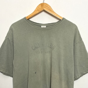 Vintage 1990s Calvin Klein Jeans Spell Out Graphic Beige Tee Shirt (fits adult Large)