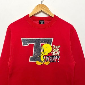 Vintage 1990s Tweety Bird Looney Tunes hecho en EE.UU. Spell Out Graphic Cartoon Pullover Crewneck Sudadera (tamaño adulto Pequeño)