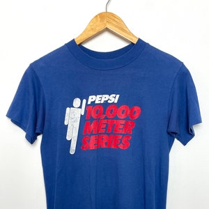 Vintage 1980s Pepsi 10,000 Meter Series The Oldies Channel Graphic Tee Shirt (size adult Small)