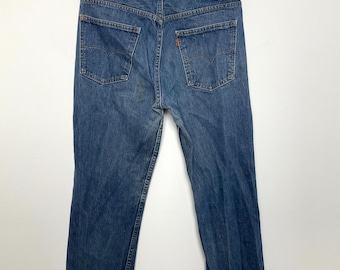 Vaqueros Levi's vintage de los años 80 con pierna recta y lengüeta naranja, fabricados en EE. UU. (talla 34)