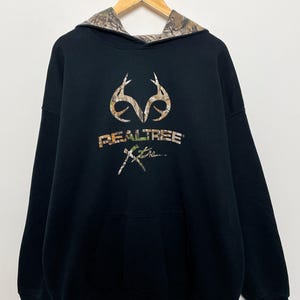 ヴィンテージ リアルツリー カモフラージュ 鹿狩り スペルアウト アントラー グラフィック パーカー スウェットシャツ (大人用 XXL サイズ)