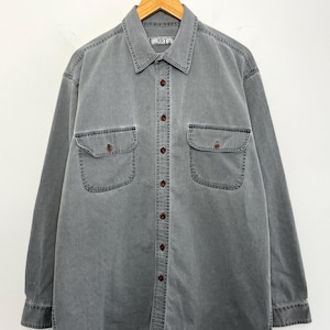 Camisa vintage de manga larga con botones de pana fina en tonos descoloridos de la marca SRT, de los años 90 (talla L de adulto).