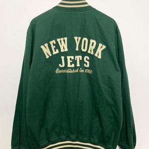New York Jets NFL Football Green and Beige Spell Out Graphic Bomber Jacket (size adult Large)