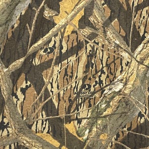 May include: Close-up of a camouflage pattern in shades of brown, tan, and green. The design includes tree branches and leaf shapes, with the "Mossy Oak" logo visible.