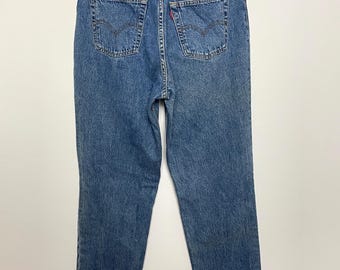 Pantalones vaqueros Levi’s 801 de mezclilla azul para mujer, estilo vintage de los años 80, con cierre de botones.