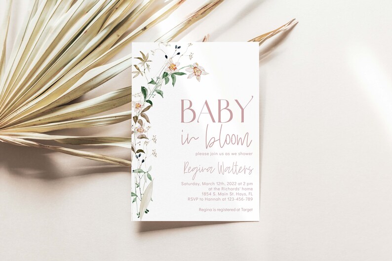 May include: A baby shower invitation with a floral design and the text "BABY in bloom" in pink. The invitation includes the name "Regina Walters" and details for the shower, including the date, time, location, and RSVP information.