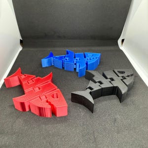 Juguetes flexibles surtidos: T-Rex, unicornio, tiburón, fidget