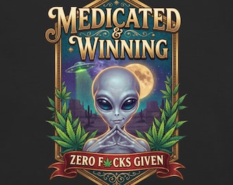 May include: A graphic print featuring a grey alien with large black eyes, centered within a gold-bordered frame. The text reads MEDICATED & WINNING and ZERO F*CKS GIVEN. The design includes green cannabis leaves, a UFO, and a full moon.