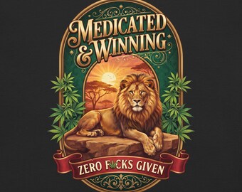 May include: A graphic print featuring a lion resting on a rock against a sunset savanna background, framed by green cannabis leaves. The text reads MEDICATED & WINNING at the top and ZERO F*CKS GIVEN on a red banner at the bottom.