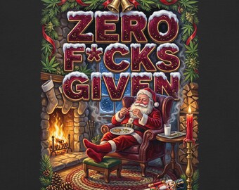 May include: A graphic print featuring Santa Claus sitting in a leather armchair by a fireplace, eating cookies and drinking milk. The text ZERO F*CKS GIVEN is displayed in large, snow-dusted letters above him, framed by green cannabis leaves.