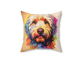 May include: A colorful, abstract painting of a dog's face on a square throw pillow. The dog has a light brown and white coat and is surrounded by splashes of vibrant colors, including blue, green, yellow, orange, and purple.