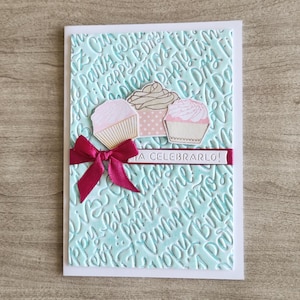 Handmade Birthday Card with Cupcakes and Embossed Words – Aqua and Pink Celebration Card – “¡A Celebrarlo!” Ribbon Detail - Gift for her