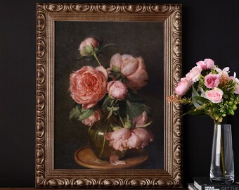 May include: A framed painting of a bouquet of pink peonies in a green vase on a wooden table. The painting is in a gold ornate frame.