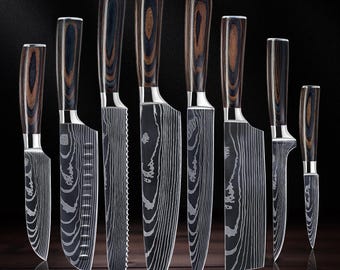 May include: A set of eight kitchen knives with dark wood handles and patterned blades. The blades have a unique wood grain design. The knives vary in size, with the largest blade measuring approximately 12 inches.